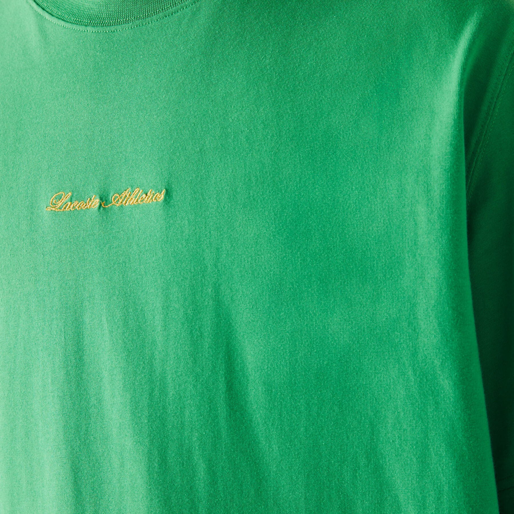 لاكوست تي شيرت قطني للجنسين قصة فضفاضة وتطريز ذهبي مجموعة lacoste live