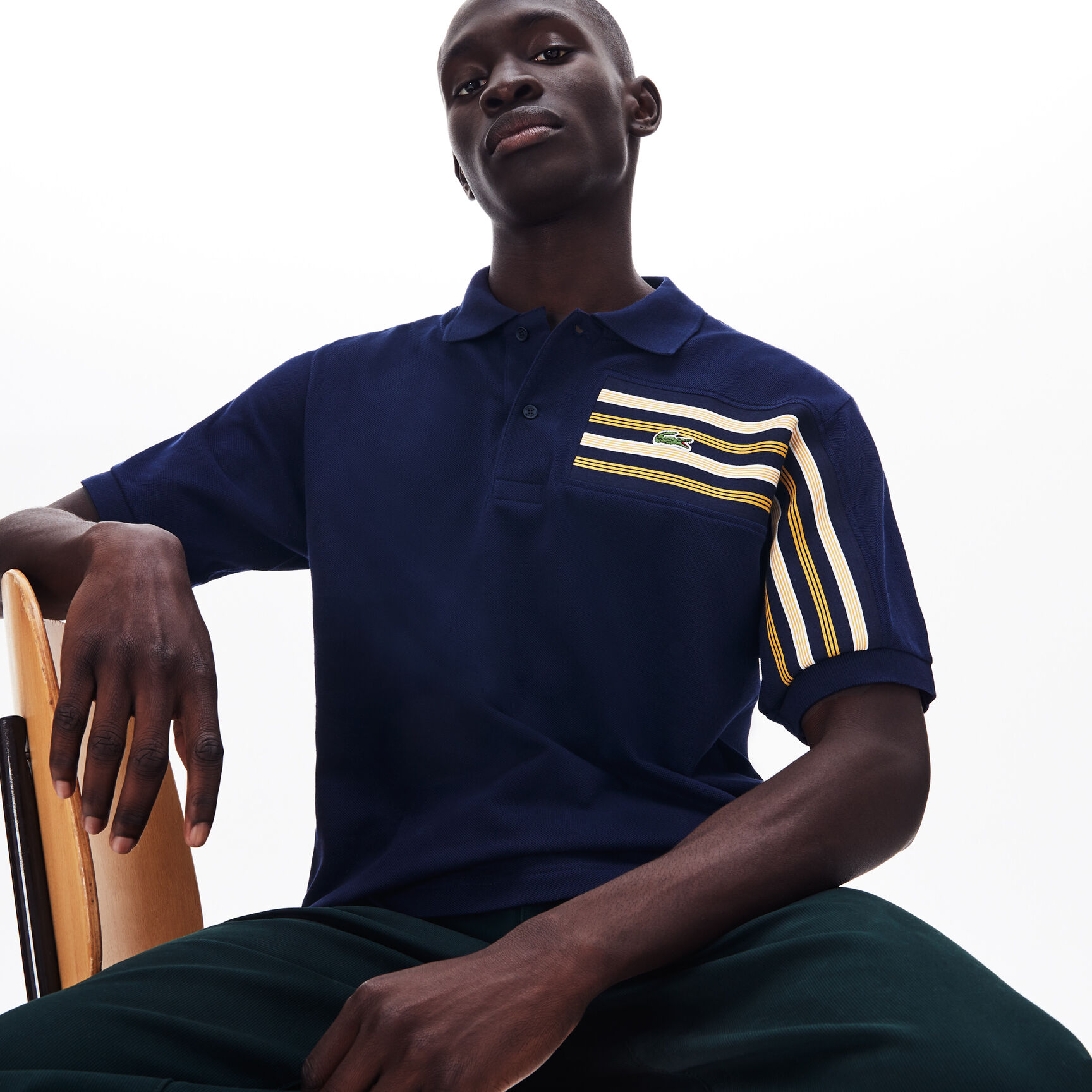 قميص بولو للرجال مقلم محيك من قطن البيكيه من مجموعة Lacoste L.12.12