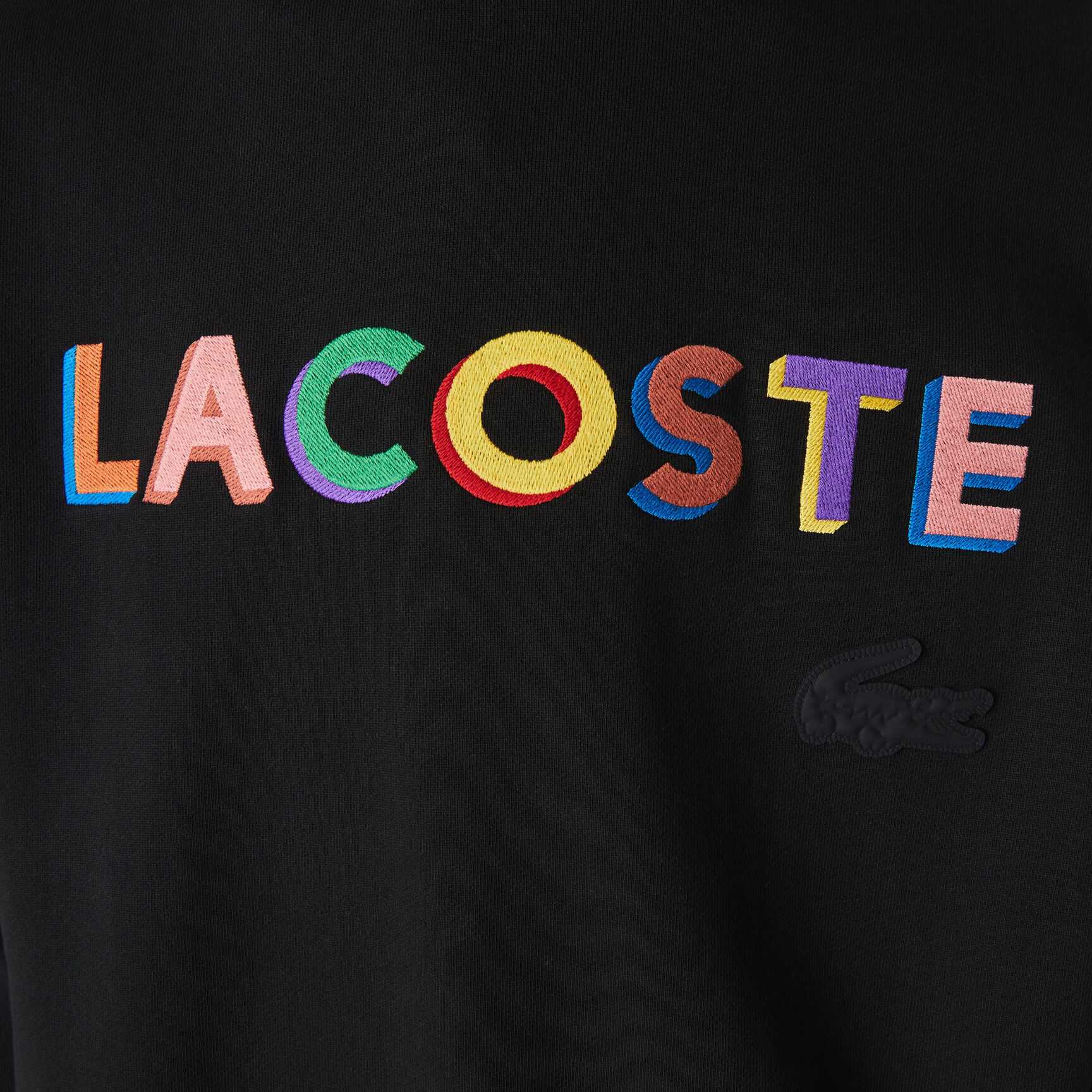 كنزة فضفاضة مطرزة من الصوف للجنسين من مجموعة Lacoste L!VE