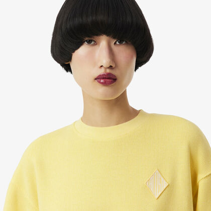 قميص رياضي واسع من قماش إنترلوك