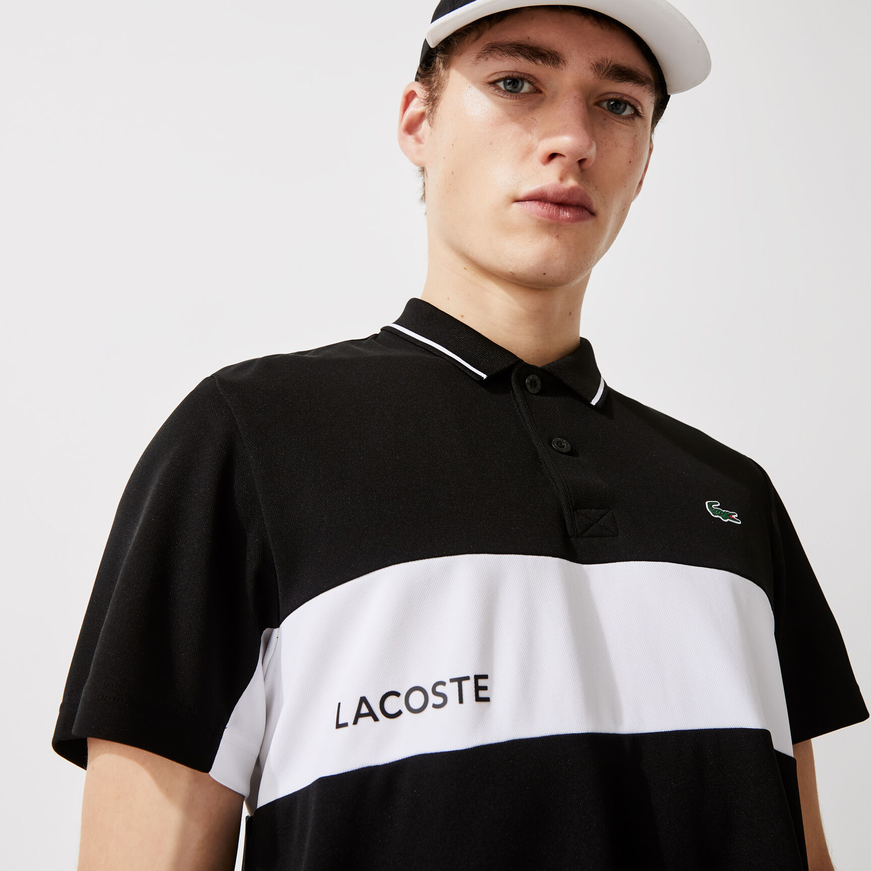 قميص بولو مقاوم مسامي للرجال مع كتل لونية مجموعة Lacoste SPORT