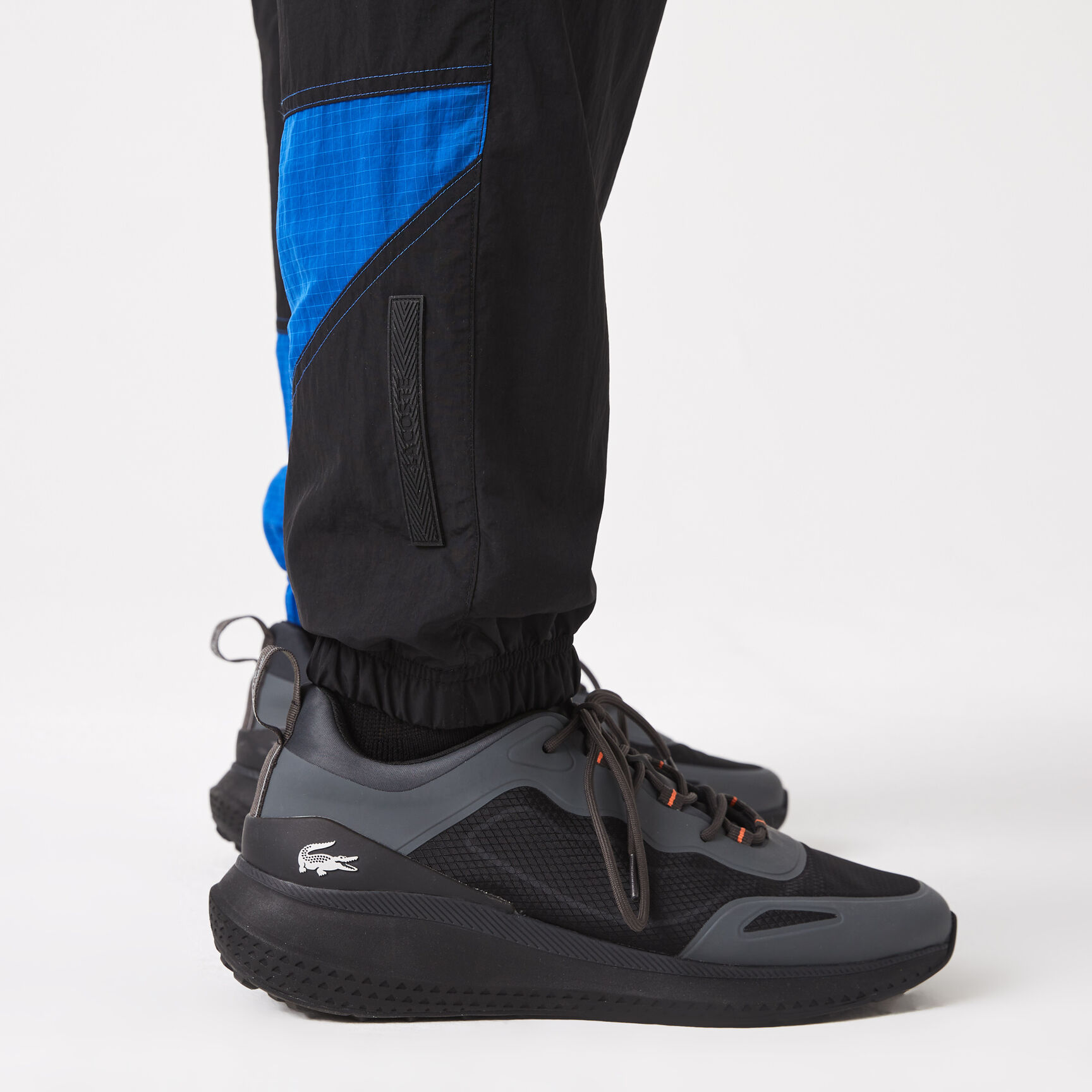 بنطال رياضي لاكوست مقسم لأجزاء ومقاوم للماء للرجال