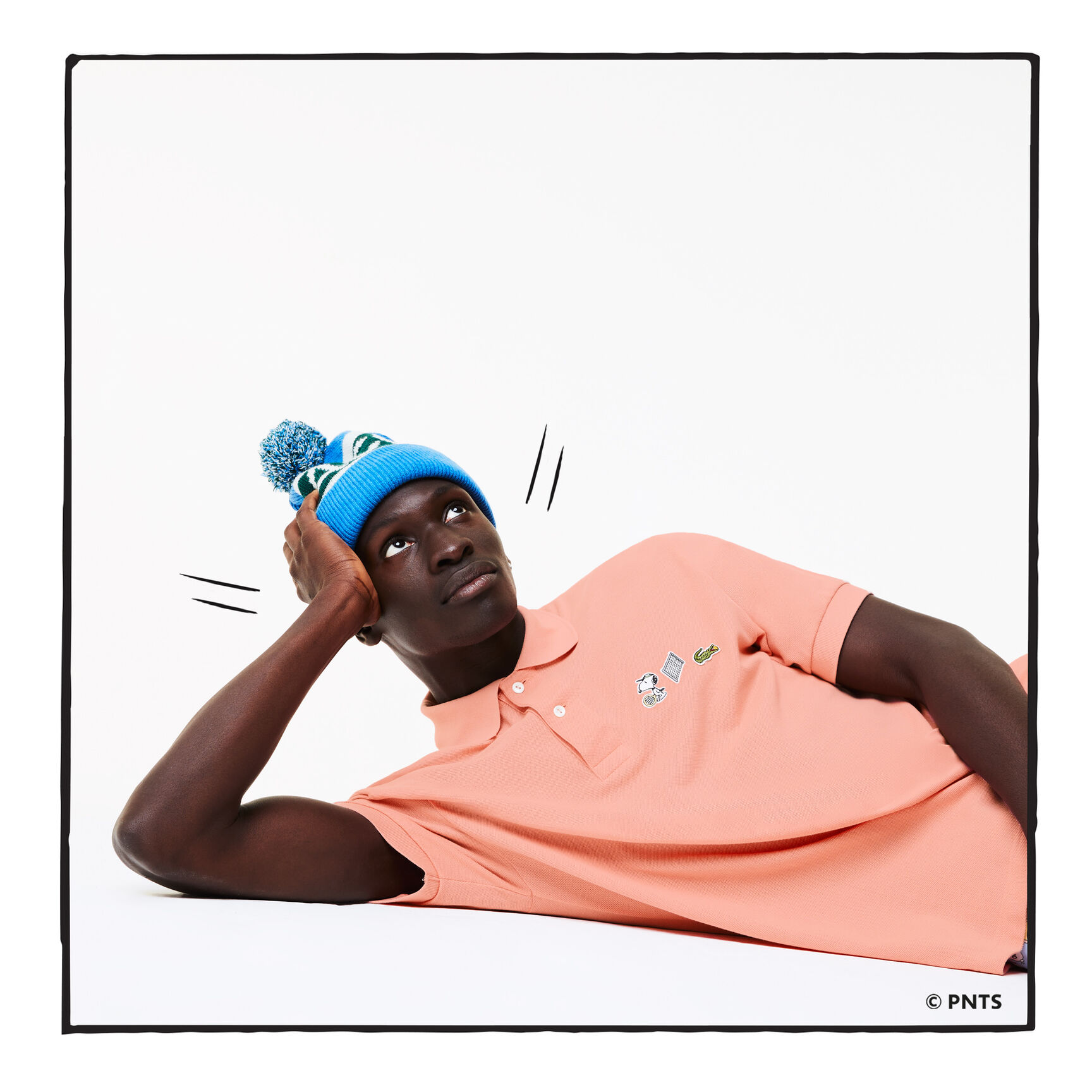 قميص بولو من القطن العضوي الرجالي من مجموعة Lacoste x Peanuts قميص بولو من القطن العضوي الرجالي من مجموعة Lacoste x Peanuts