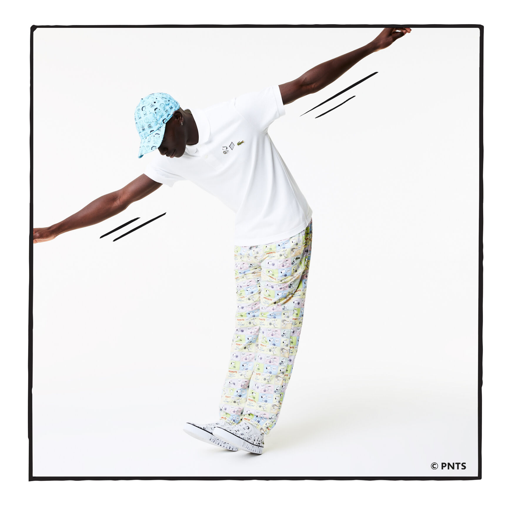 قميص بولو من القطن العضوي الرجالي من مجموعة Lacoste x Peanuts قميص بولو من القطن العضوي الرجالي من مجموعة Lacoste x Peanuts