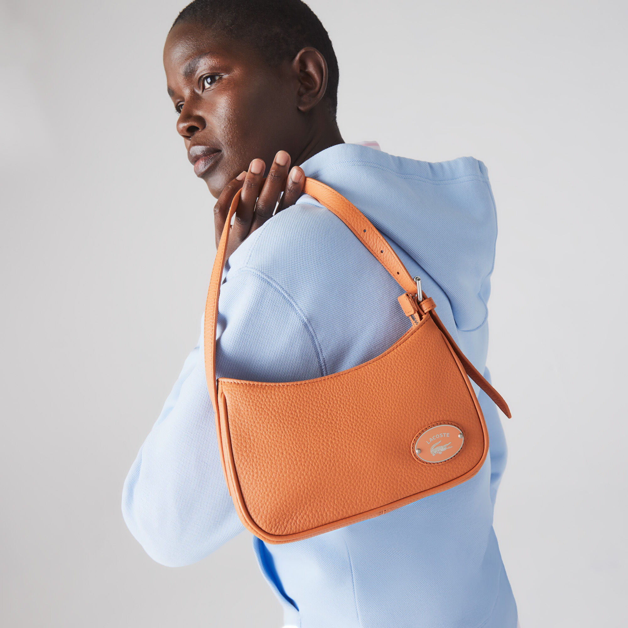 Lacoste leather sling bag deals