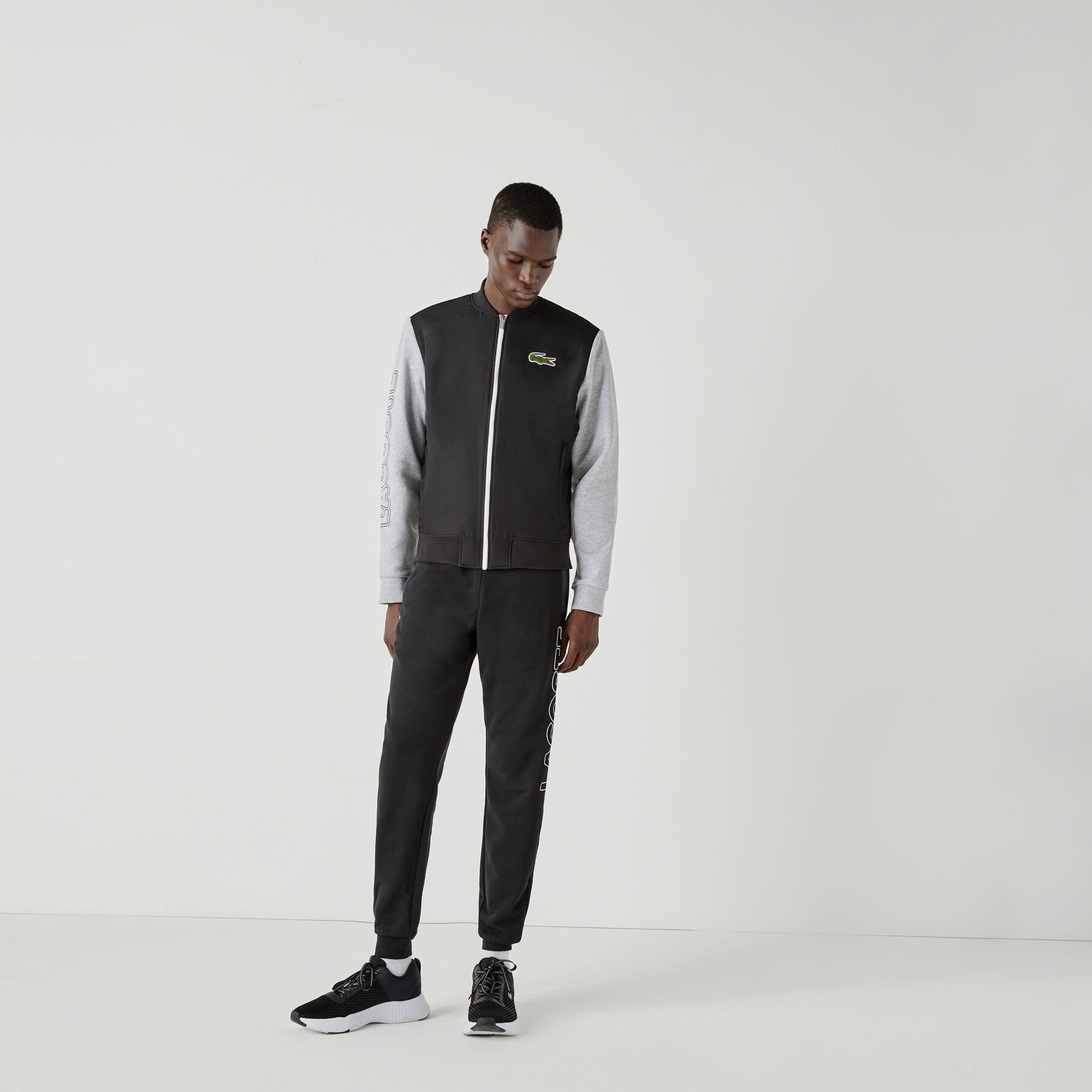 لاكوست جاكيت تيدي بسحاب من الصوف مع طبعة ثنائية اللون للرجال من مجموعة lacoste sport